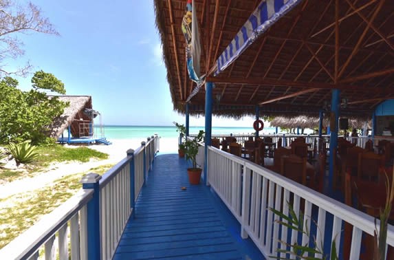 restaurant with guano roof next to the sea