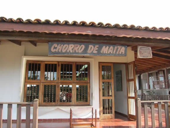 reception booth with wooden sign outside