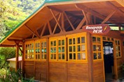 wooden house with reception desk sign