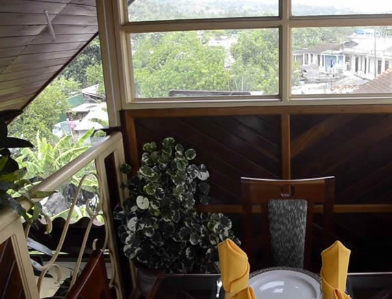 covered terrace with wooden furniture