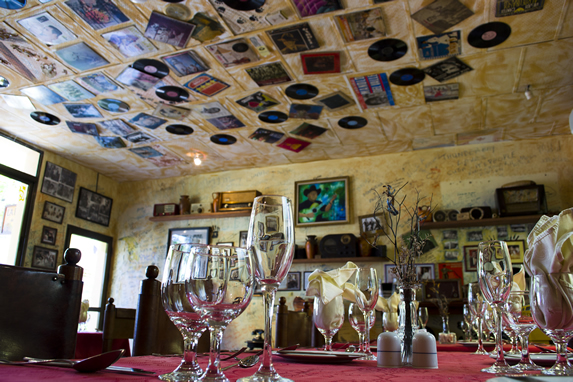 restaurant decorated with old records and photos