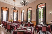 restaurant with wooden furniture and big windows