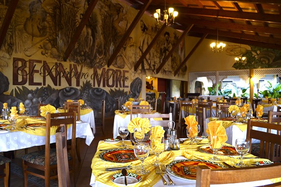 restaurant with wooden furniture and table linen