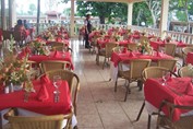 restaurant with wicker furniture and table linen