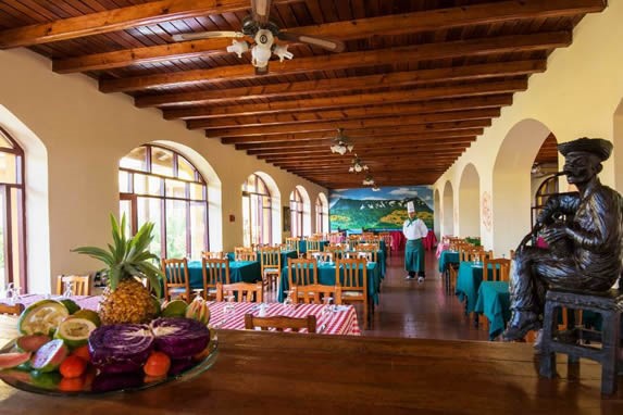 restaurant with wooden ceiling and large windows