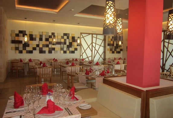 restaurant with wooden furniture and table linen
