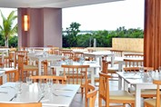 restaurant with wooden furniture and ocean view