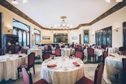 wooden furniture with tablecloths in restaurant