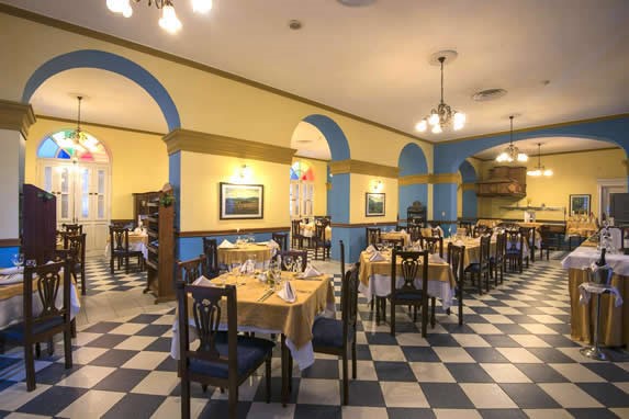 restaurant with wooden furniture and stained glass