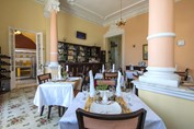 restaurant with wooden furniture and tablecloths