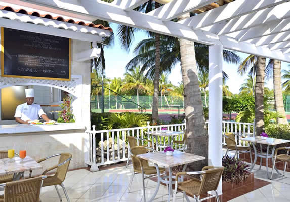 outdoor grill restaurant with palm trees