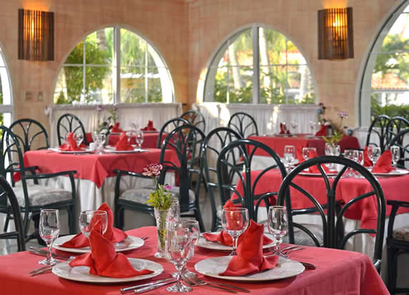 restaurant with red furniture and tablecloths