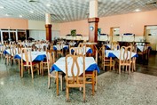 Restaurant with light wooden furniture