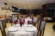 restaurant with wooden furniture and table linen
