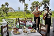 open-air restaurant with musicians playing