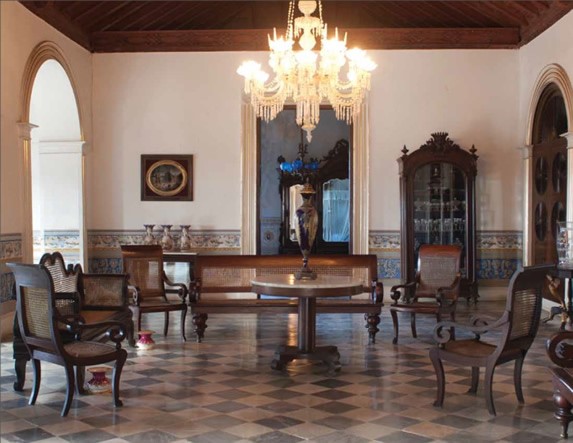 Museum hall decorated with antique furniture.