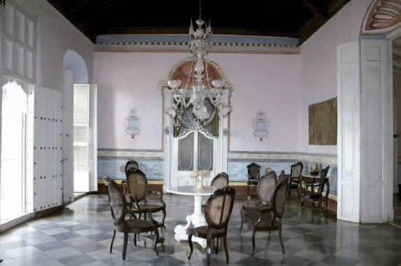 Museum hall decorated with antique furniture.