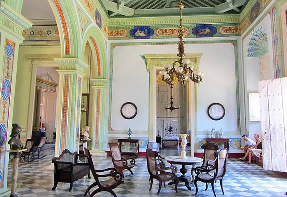 Museum hall decorated with antique furniture.