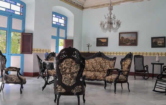 living room with antique furniture and paintings