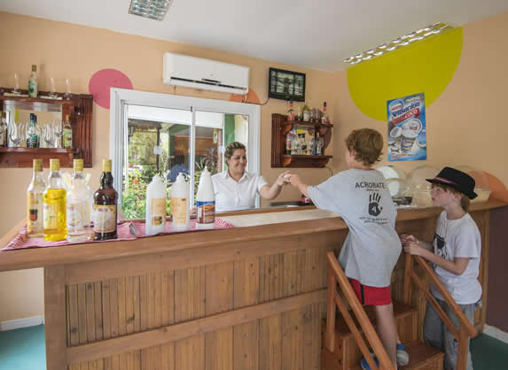 bar with wooden bar and children with ice cream