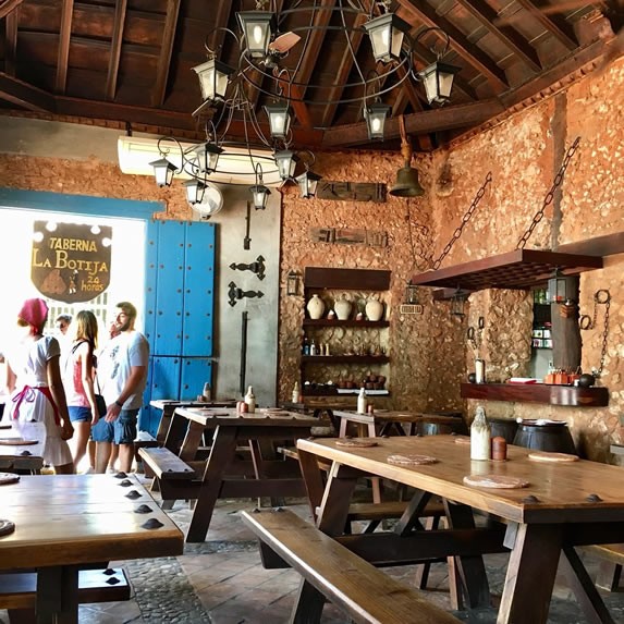 restaurant with wooden furniture and roof