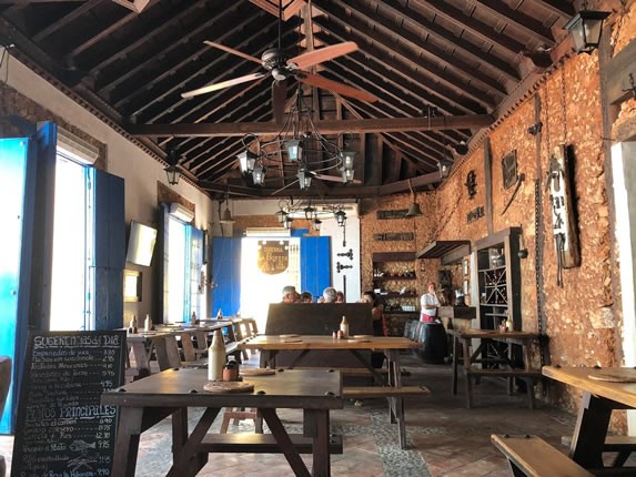 restaurant with wooden furniture and roof