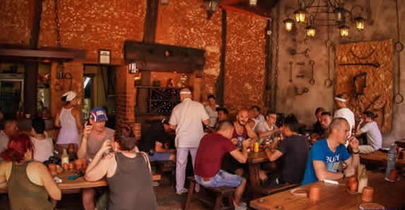 Rustic restaurant lounge with people eating