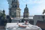 table served on terrace overlooking the city