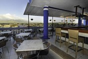 terrace with furniture and wooden bar