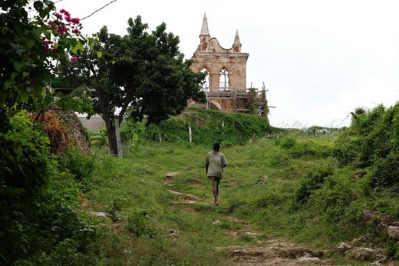 hill with architectural ruin in the background