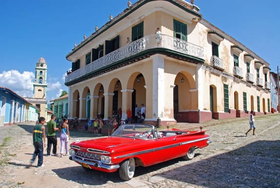 old car through the city streets