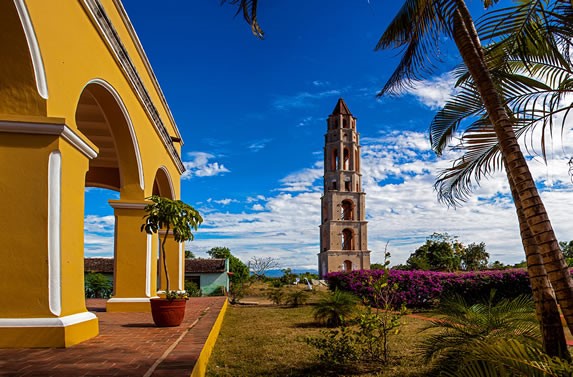 yellow colonial house and colonial tower