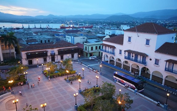 square surrounded by colonial buildings at sunset
