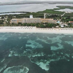 aerial view of the hotel surrounded by the sea