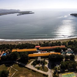 aerial view of the hotel by the coast