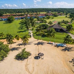 aerial view of the hotel with sand and vegetation