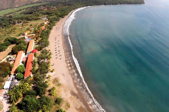 aerial view of the hotel by the coast