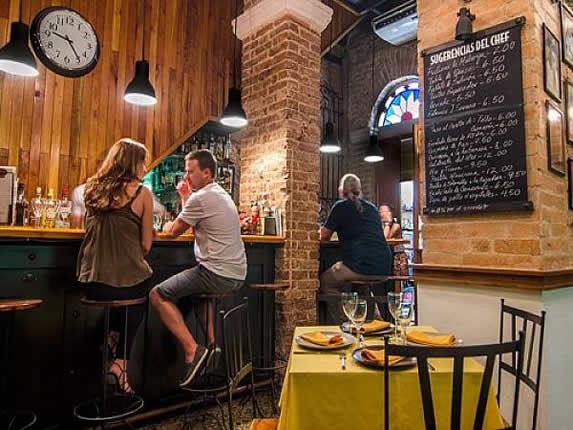 living room with brick walls inside the cafe