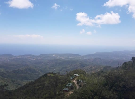 view of green mountains under blue sky