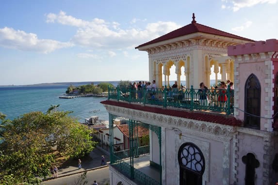 tourists on the terrace overlooking the sea