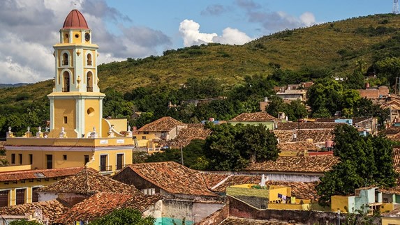 View of the convent surrounded by rooftops and mou