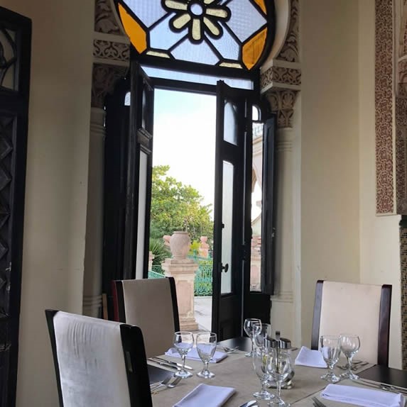 table with tablecloth and decorative stained glass