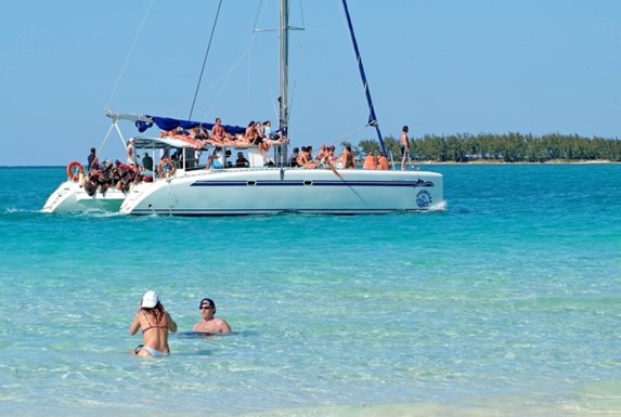 catamaran with tourists on the beach
